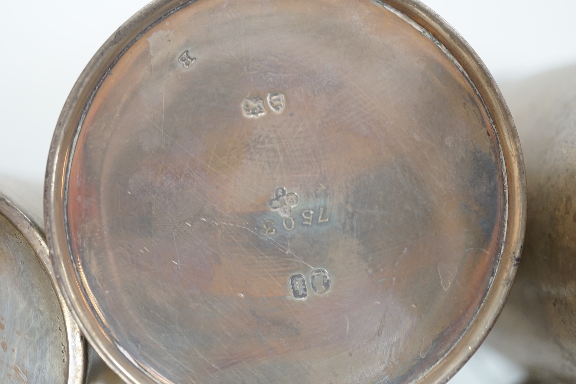 A Victorian engraved silver christening mug, The Barnards, London, 1871, 82mm and two later silver mugs, 14oz.